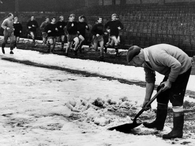 The way we were - clearing snow of the pitch before a Boxing Day game in the 1960s